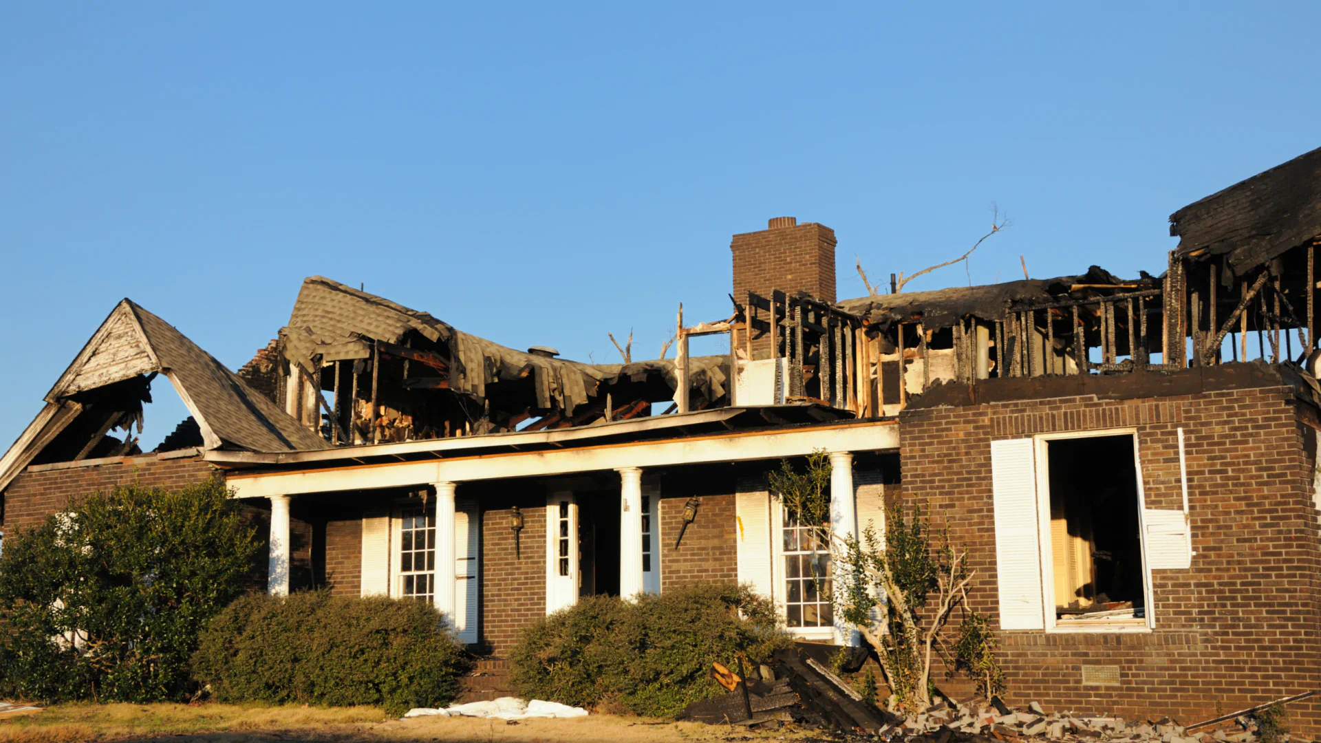 aftermath effect of fire on a residential house burned roof gulf shores al